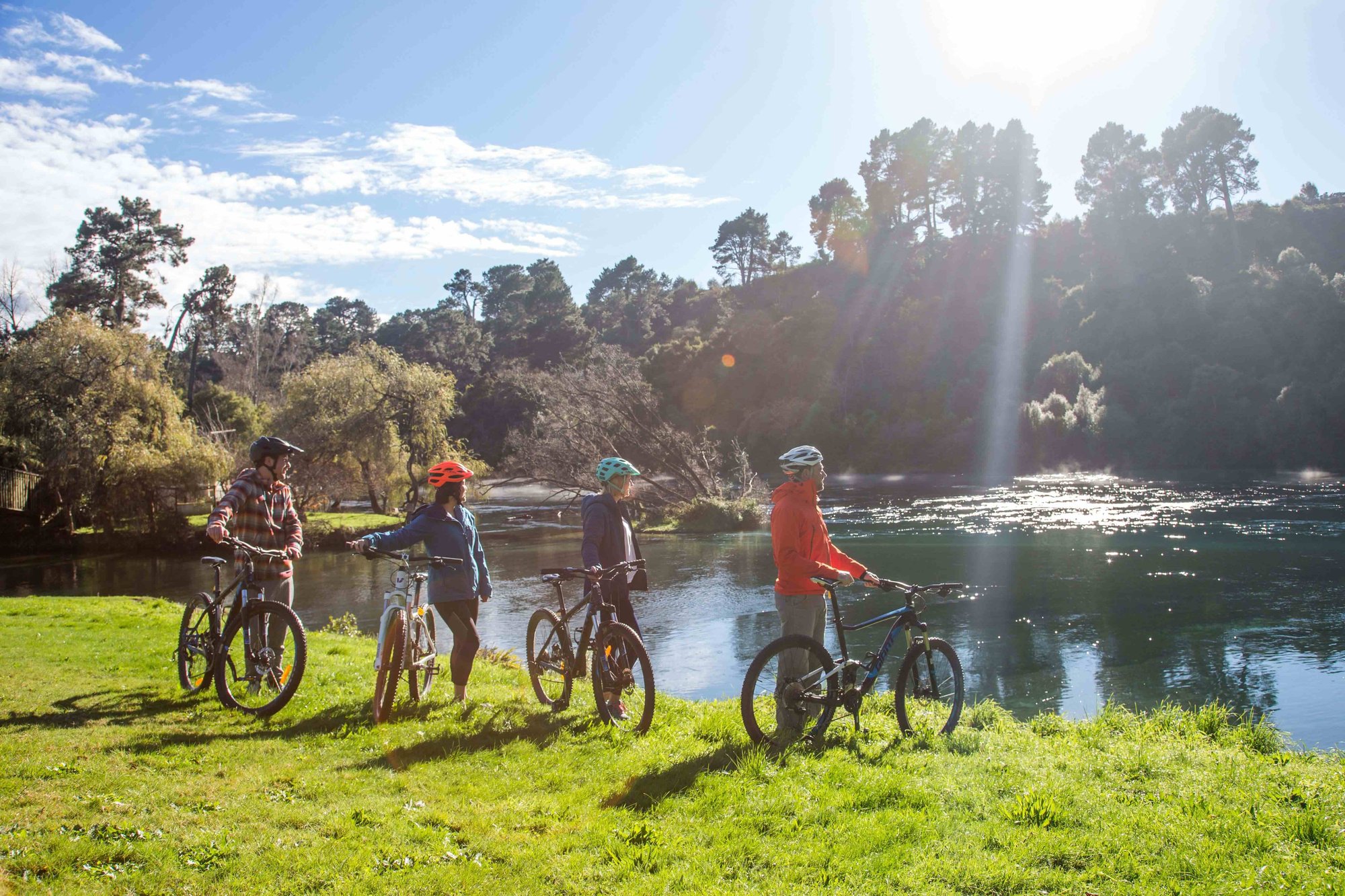 2504_img_taupo_town_supervolcanic_riverside_trail_biking_kids_standing_waikato_river