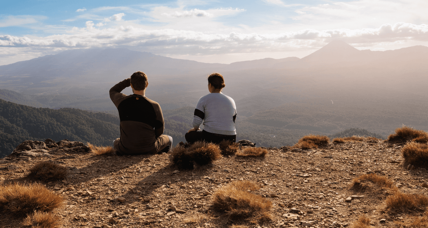 2504_img_taupo_region_mount_urchi_hiking_couple_sitting_down_mountain_view-1