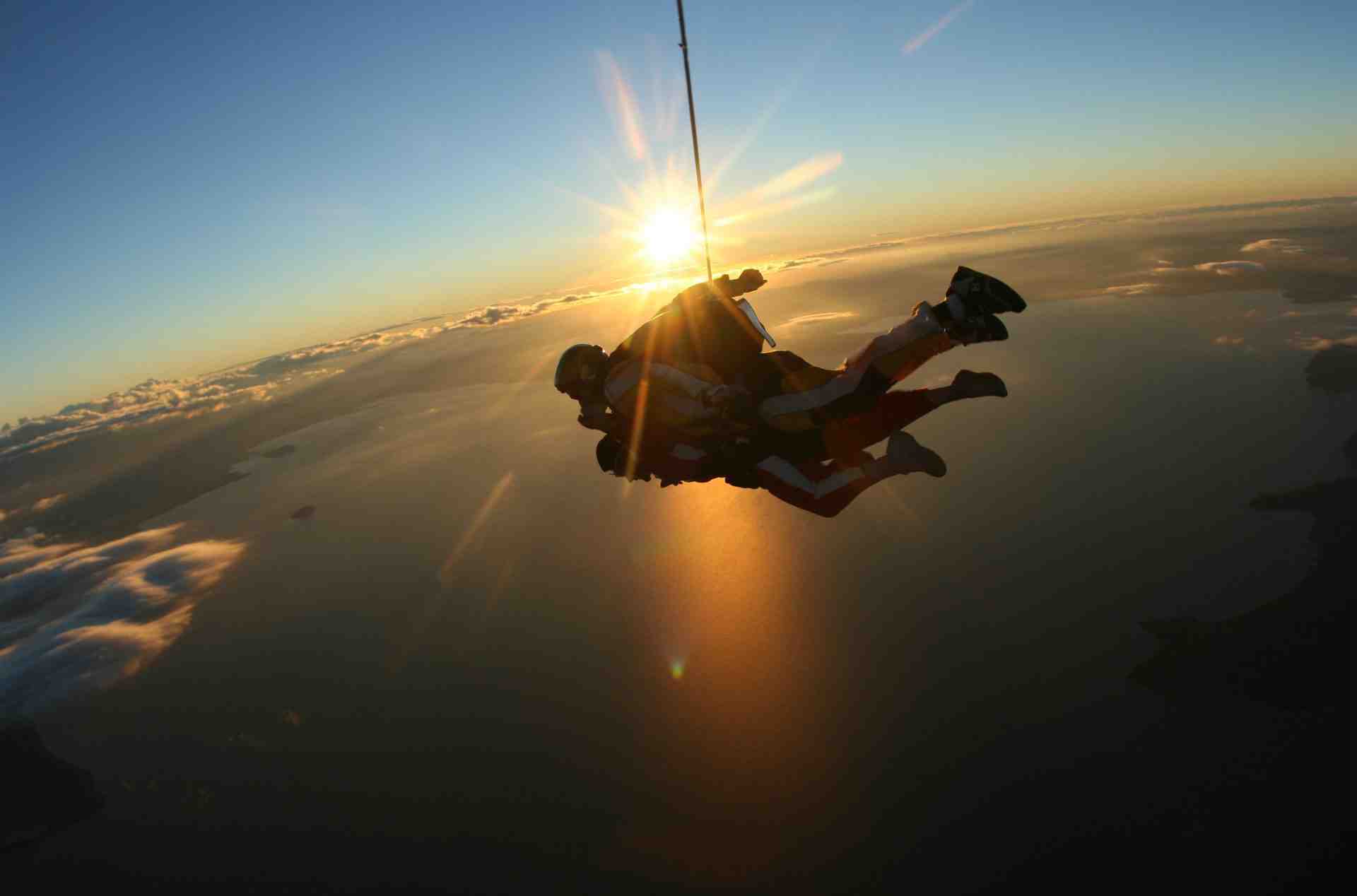 Tandem skydiving at sunset over Lake Taupō